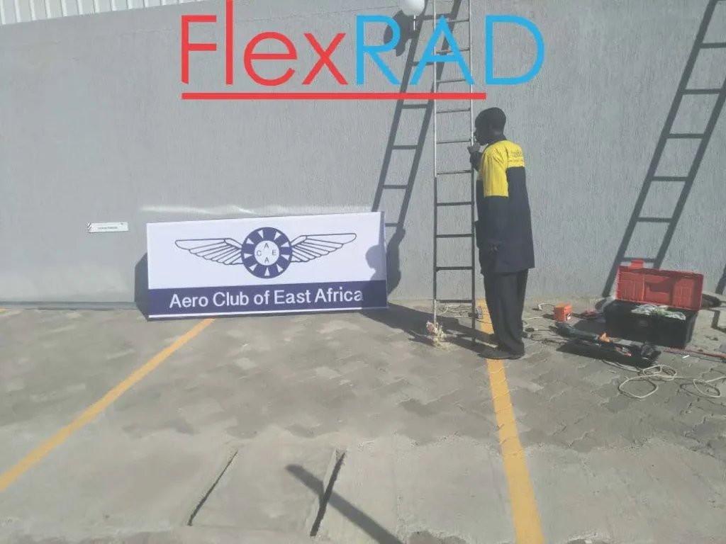 Light box sign installation in progress at Wilson Airport, Nairobi