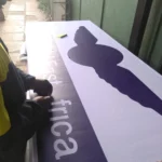 Person working on light box sign production