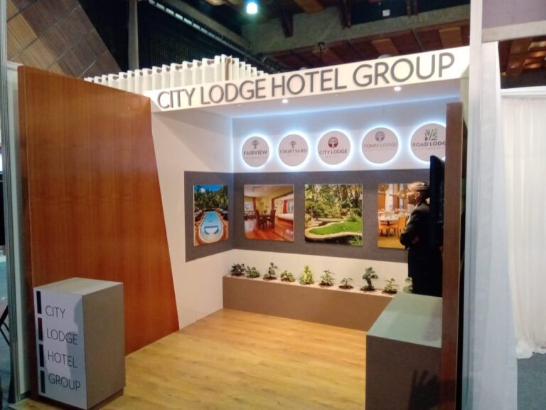 Illuminated signage on an exhibition booth